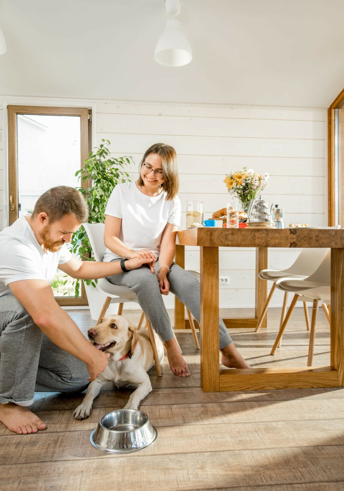 Young couple with dog at home | Floors & More Evanston